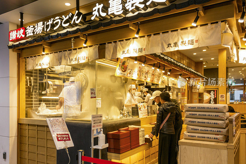 The Marugame Seimen (Japanese: 丸亀制麺), also known as Marugame Udon, is a Japanese restaurant chain specializing in udon. Restaurant front view in Tokyo, Japan.